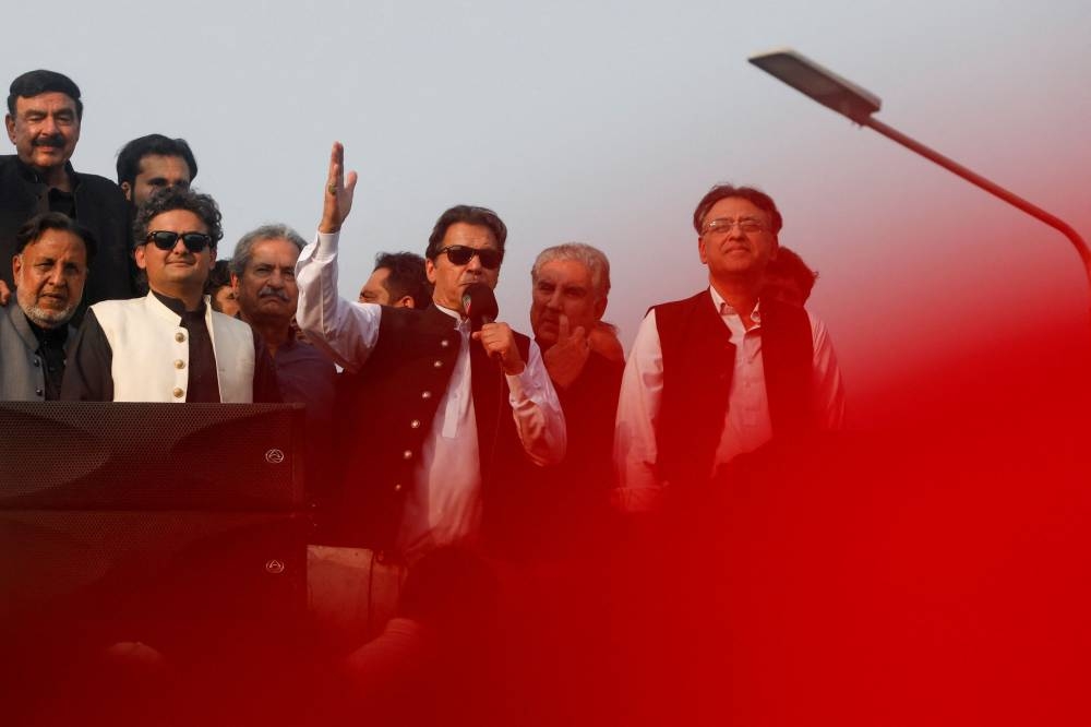 Pakistan’s former prime minister Imran Khan addresses his supporters, during what they call ‘a true freedom march’, to pressure the government to announce new elections, in Lahore in this file picture taken on October 28, 2022. — Reuters pic