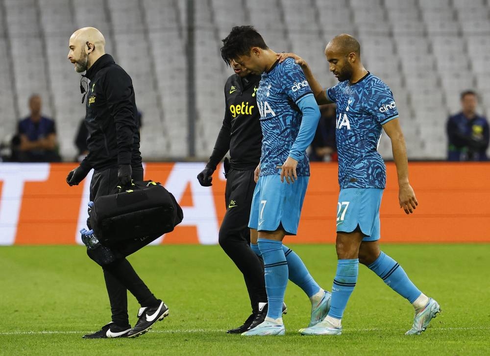Tottenham Hotspur’s Son Heung-min is helped off the pitch after sustaining an injury during a match against Olympique de Marseille at Orange Velodrome, Marseille, France, November 1, 2022. — Reuters pic 