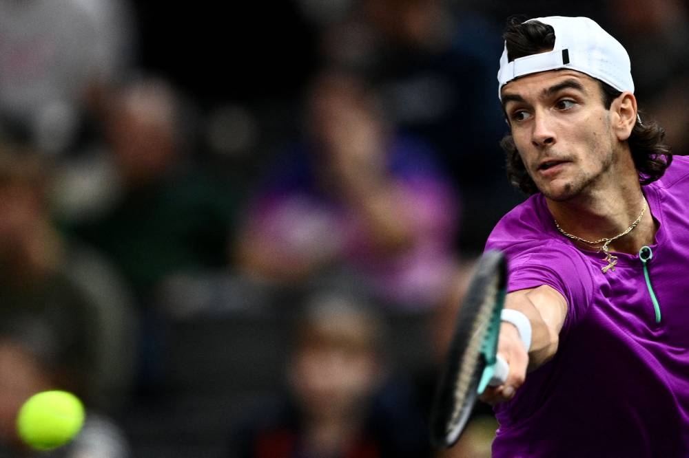 Italy’s Lorenzo Musetti returns the ball during the men’s singles round of 8 tennis match against Norway’s Casper Ruud on day four of the ATP World Tour Masters 1000 at The AccorHotels Arena in Paris, November 3, 2022. — AFP pic 