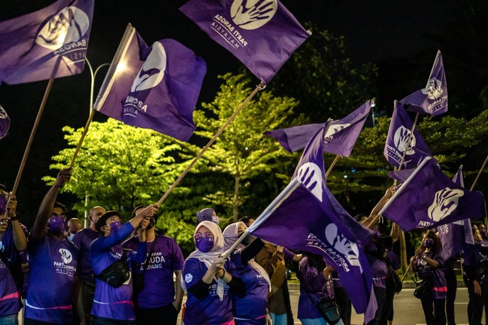 Parti Bangsa Malaysia (PBM) supporters wave flags at the party’s election machinery launch in Ampang on November 3, 2022. — Picture by Firdaus Latif
