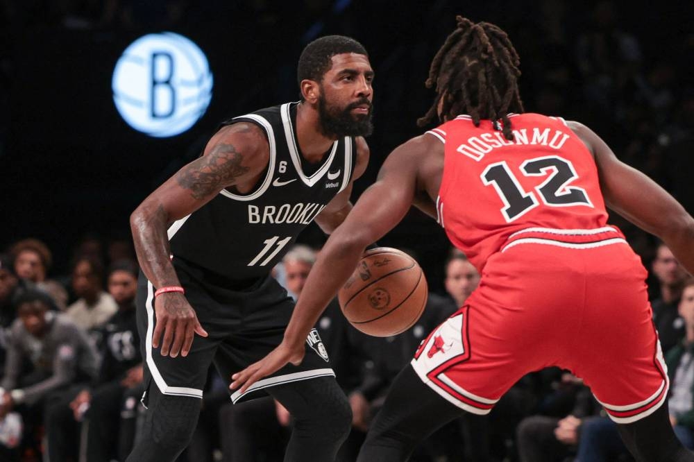 Brooklyn Nets guard Kyrie Irving (11) dribbles as Chicago Bulls guard Ayo Dosunmu (12) defends during the first quarter at Barclays Center in Brooklyn November 1, 2022. — Reuters pic