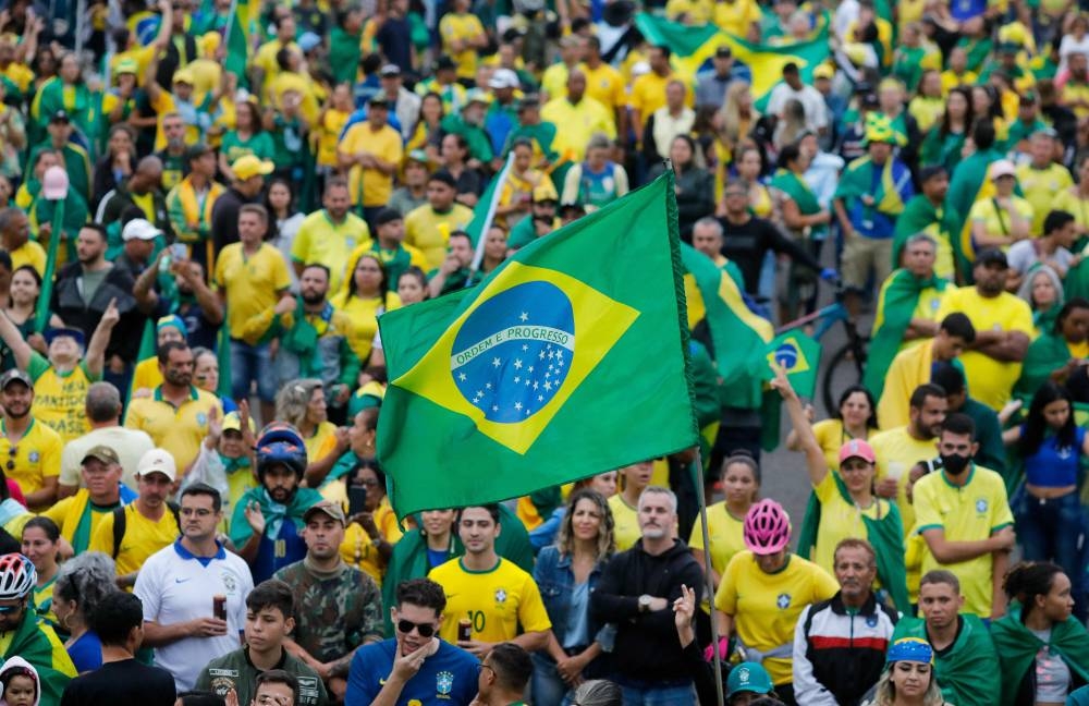 Supporters of Brazilian President Jair Bolsonaro take part in a protest to ask for federal intervention outside the Army headquarters in Brasilia, on November 2, 2022. — AFP pic
