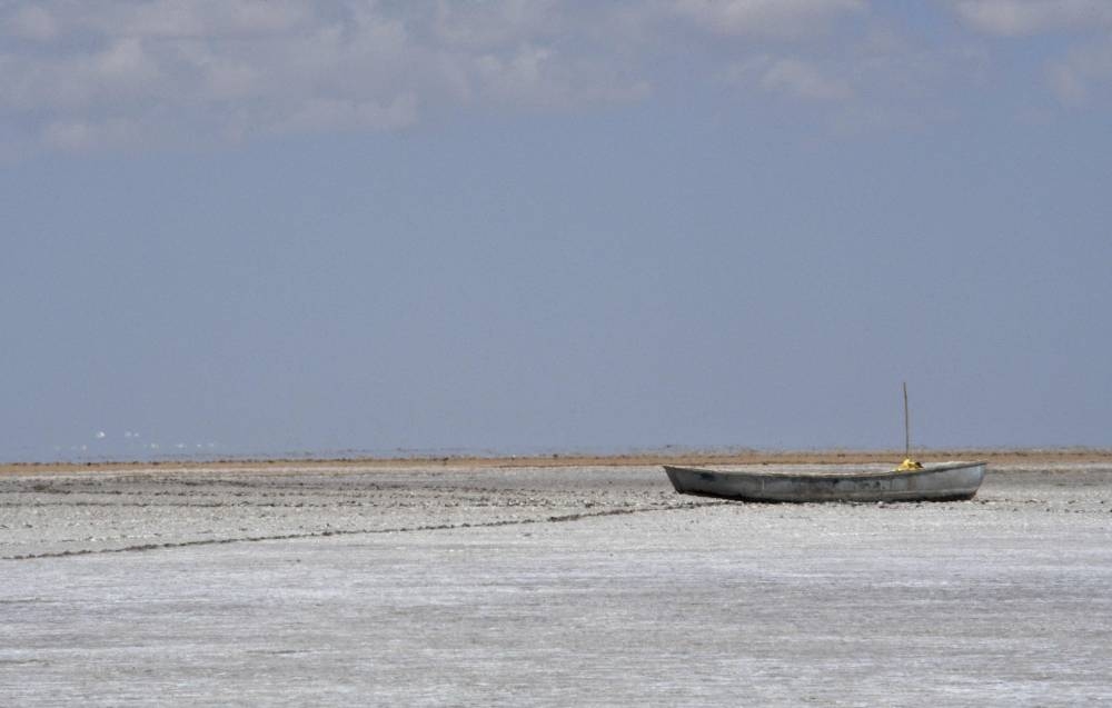 An abandoned boat sits on the bed of former Lake Poopo, in the desert near Punaca Tinta Maria, Bolivia, taken on October 14, 2022. — AFP pic
