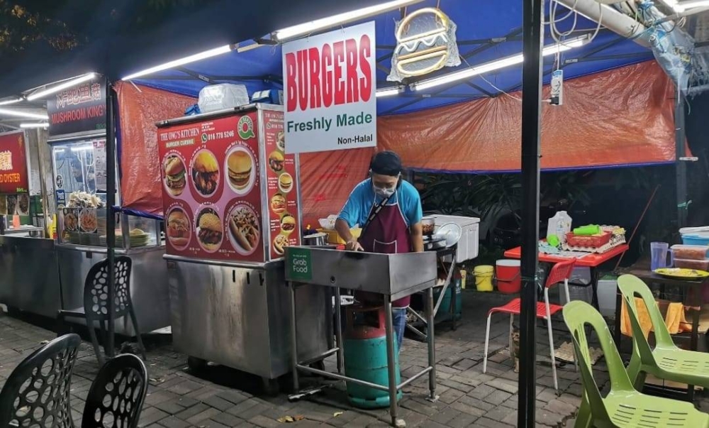 Bandar Sunway burger stall helps independent rescuer look after stray