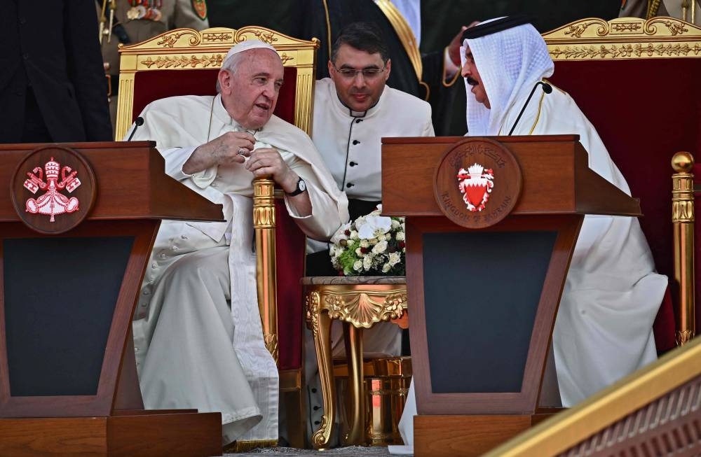 Pope Francis (left) addresses Bahrain's King Hamad bin Isa al-Khalifa during the closing ceremony for the Bahrain Forum for Dialogue at Sakhir Royal Palace, in the eponymous Bahraini city on November 4, 2022. — AFP pic