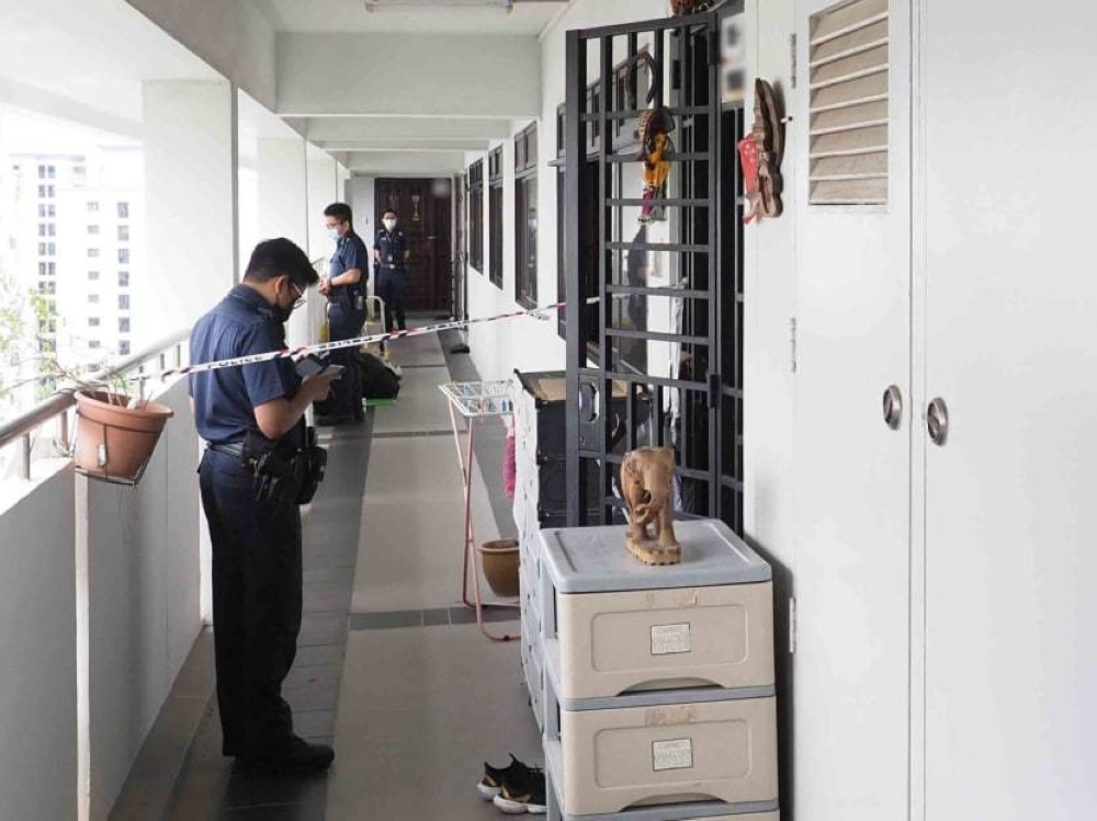 The police cordoned off a section of the common corridor outside a flat on Rivervale Drive where a 67-year-old man was found with multiple wounds and later declared dead. — TODAY pic