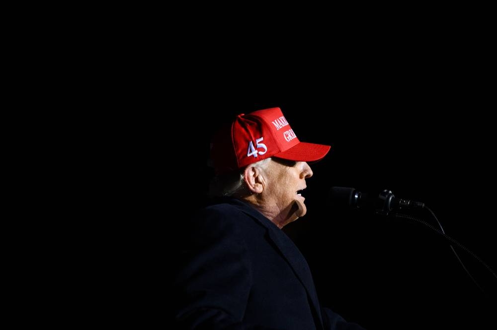 Former US President Donald Trump speaks during a campaign event at Sioux Gateway Airport on November 3, 2022 in Sioux City, Iowa. Trump held the rally to support for Iowa GOP candidates ahead of the state's midterm election on November 8th, 2022. — AFP pic