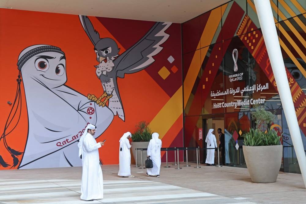 Qataris arrive for a press conference by Qatar’s Supreme Committee for Delivery & Legacy ahead of the Qatar 2022 FIFA World Cup football tournament in Doha on November 3, 2022. — AFP pic