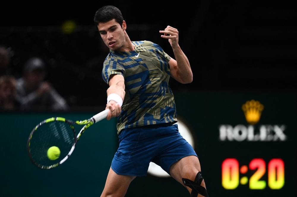 Spain's Carlos Alcaraz plays a forehand return to Japan's Yoshihito Nishioka on day three of the Paris Masters November 2, 2022. — AFP pic