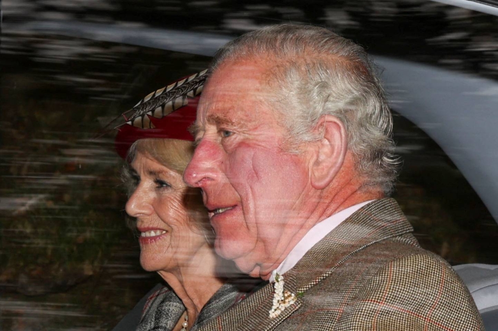 Britain's King Charles and Queen Camilla sit in a car outside Crathie Kirk near Balmoral, Scotland October 2, 2022. — Reuters pic