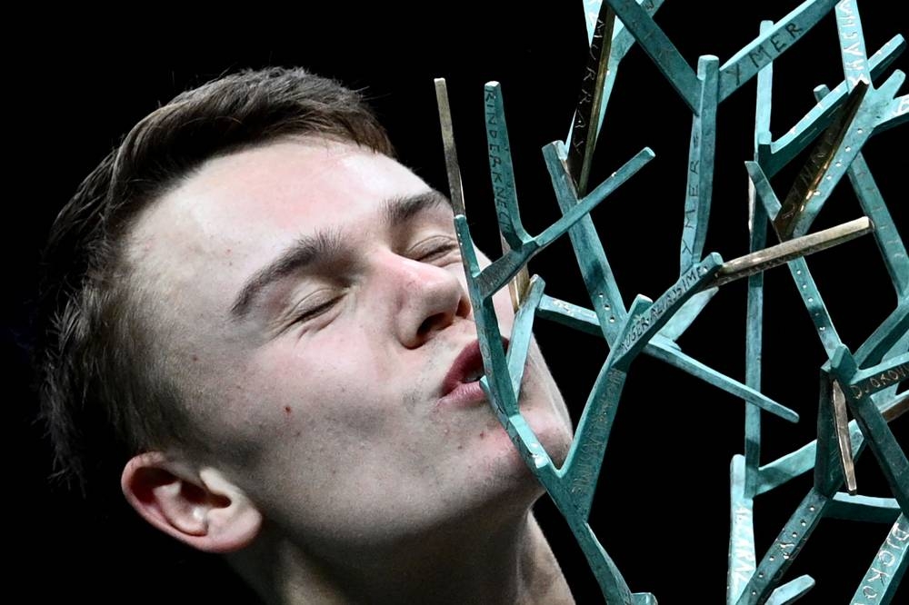 Denmark's Holger Rune celebrates with the trophy after winning his men's singles final tennis match against Serbia's Novak Djokovic, on day 7 of the ATP World Tour Masters 1000 - Paris Masters (Paris Bercy) - indoor tennis tournament at The AccorHotels Arena in Paris on November 6, 2022. — AFP pic