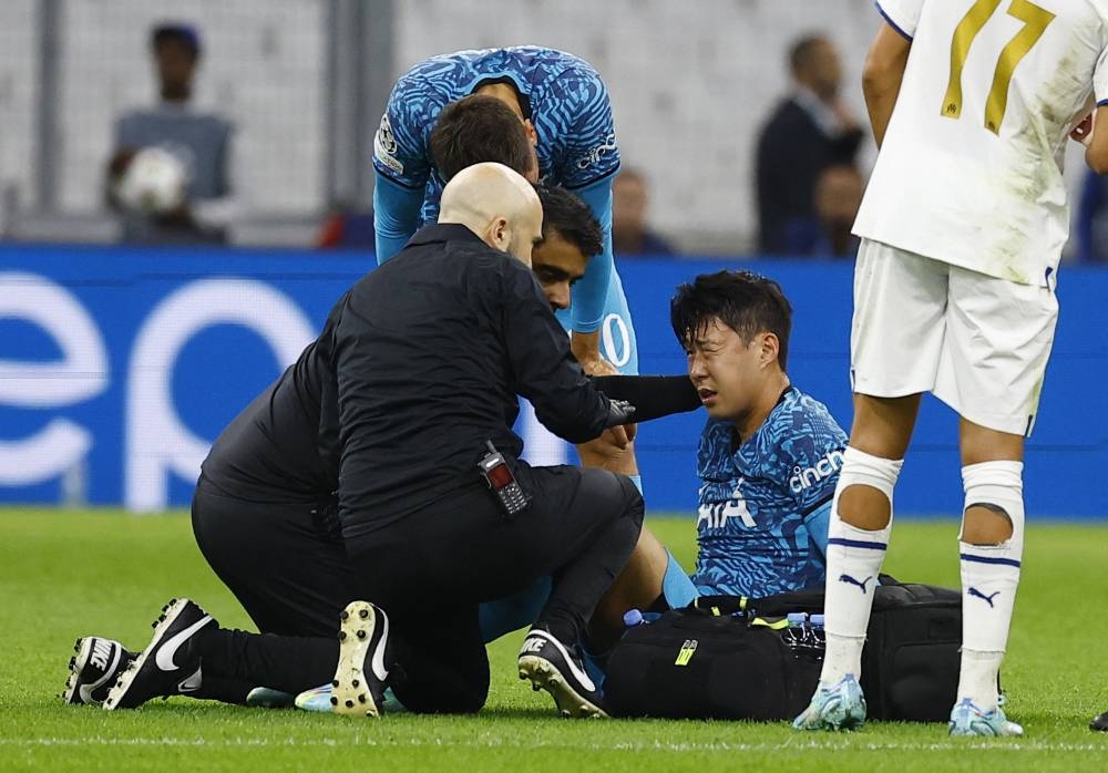 Tottenham Hotspur's Son Heung-min receives medical attention after sustaining an injury during the match against Olympique de Marseille at the Orange Velodrome, Marseille November 1, 2022. — Reuters pic