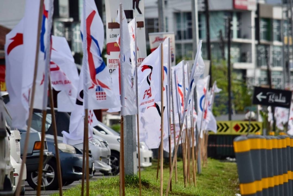 Rows of GPS and DAP flags line up the streets in Kuching, Sarawak.  —  Borneo Post Online pic