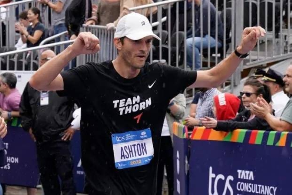 Ashton Kucher crossed the finish line of the 2022 New York City marathon and successfully raised RM 4.7 million for a charity he founded. — AFP pic