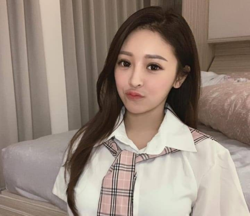 Taiwanese influencer Iris Hsieh was asked to leave a famous tourist spot in Paris after she stripped to her bra top to take pictures. — Picture via Facebook/ Iris Hsieh