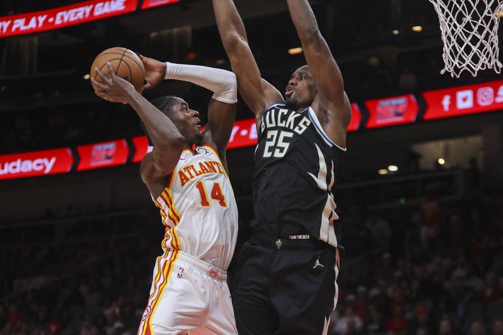 Atlanta Hawks forward AJ Griffin (14) shoots past Milwaukee Bucks forward Serge Ibaka (25) in the second quarter at State Farm Arena in Atlanta November 7, 2022. — Reuters pic