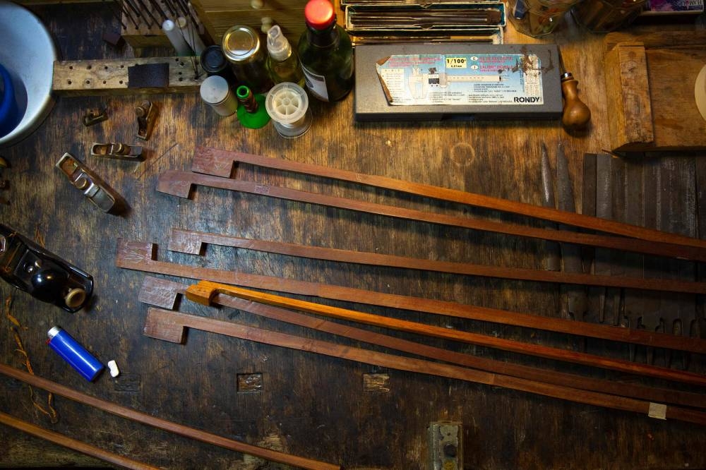 This file photo taken on October 21, 2022 shows woods pieces at the studio of French bow maker Edwin Clement. - Brazil wants to ban the usage of Pernambuco wood, also known as brazilwood, essential for making bows. — AFP pic