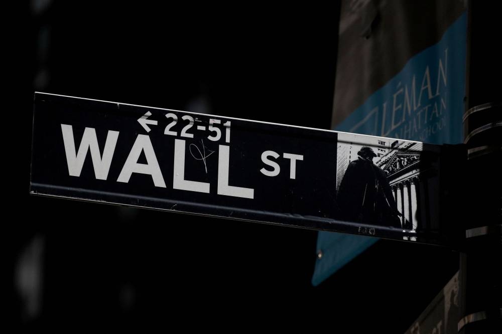 A Wall Street street sign is seen near the New York Stock Exchange in New York City September 17, 2019. — Reuters pic