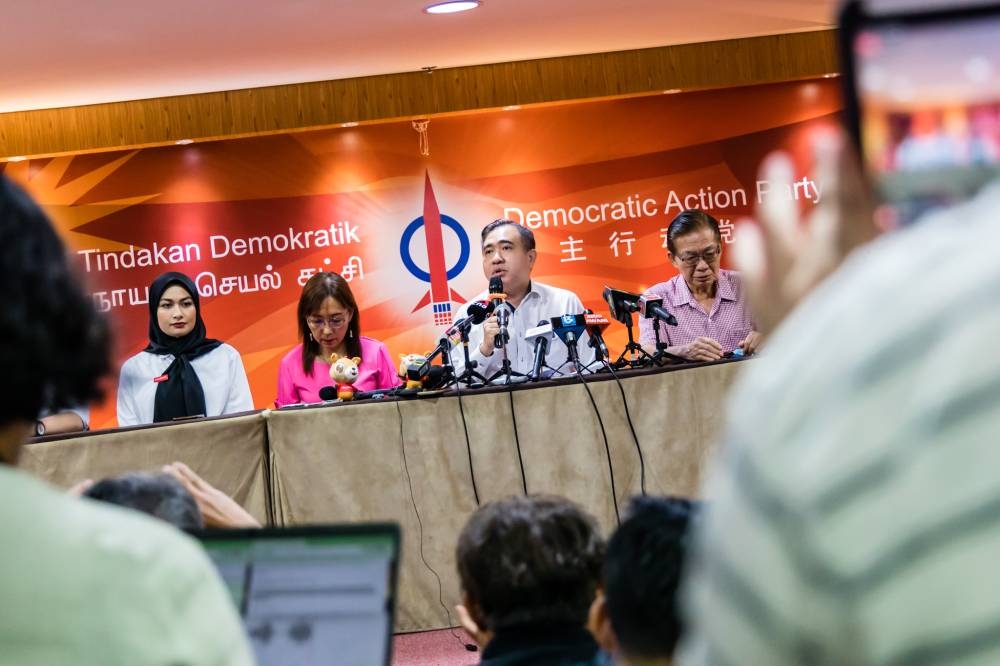 DAP secretary-general Anthony Loke (middle) says the party is attempting to shed off its image of a 'Chinese party' by fielding more Malay candidates such as Young Syefura Othman (leftmost). — Picture by Firdaus Latif