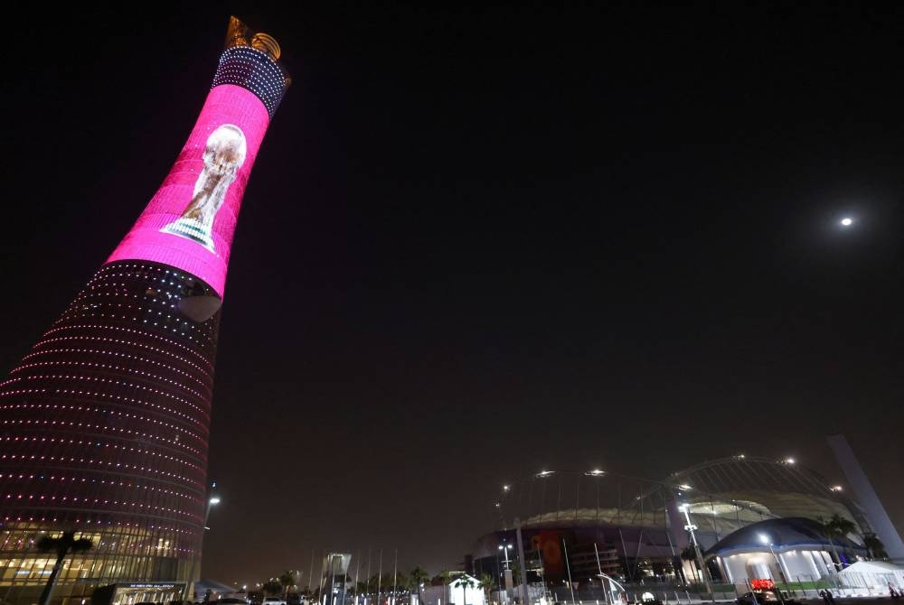 A general view of Aspire Tower with graphic lights for World Cup trophy next to Khalifa International Stadium ahead of the Fifa World Cup Qatar 2022 in Doha November 9, 2022. — Reuters pic
