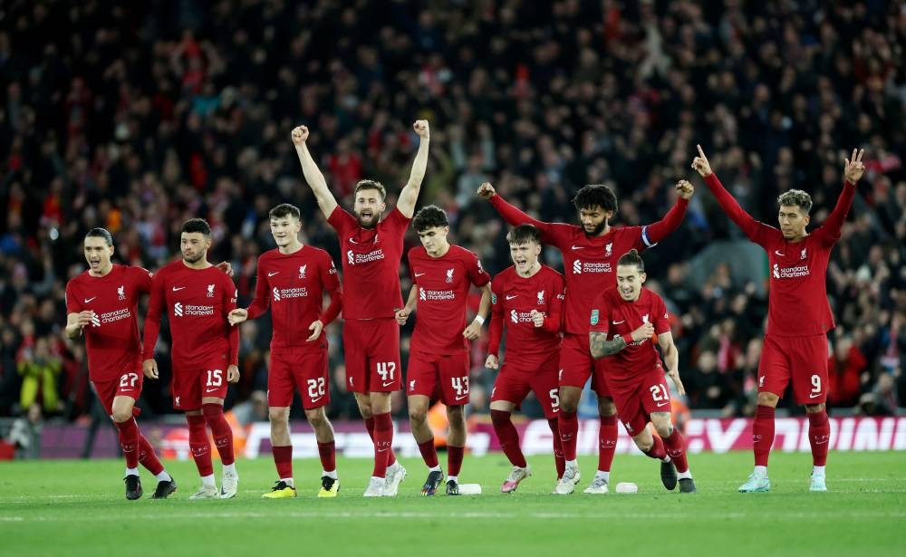  Liverpool players celebrate after winning the penalty shoot-out against Derby County at Anfield Liverpool November 9, 2022. — Reuters pic