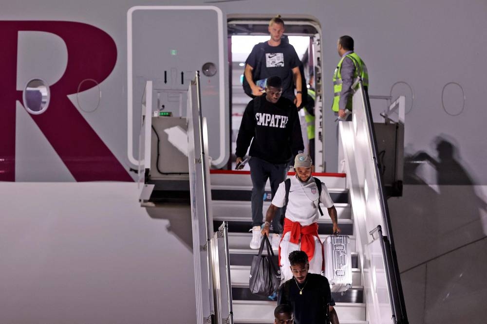 Players of team USA arrive on a Qatar Airways flight at Hamad International Airport, in the Qatari capital Doha on November 10, 2022, ahead of the Qatar 2022 Fifa World Cup football tournament.— AFP pic