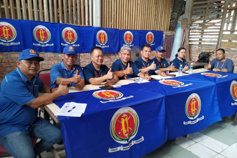 (From left) Tony, Sai, Robert, Moses, Julius, Kipli, Susan and Emilia during the launching of the PBDS GE15 manifesto. — Borneo Post pic