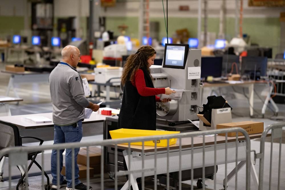 A worker prepares to scan ballots cast during the 2022 US midterm election in Philadelphia, Pennsylvania November 10, 2022. ― Reuters pic
