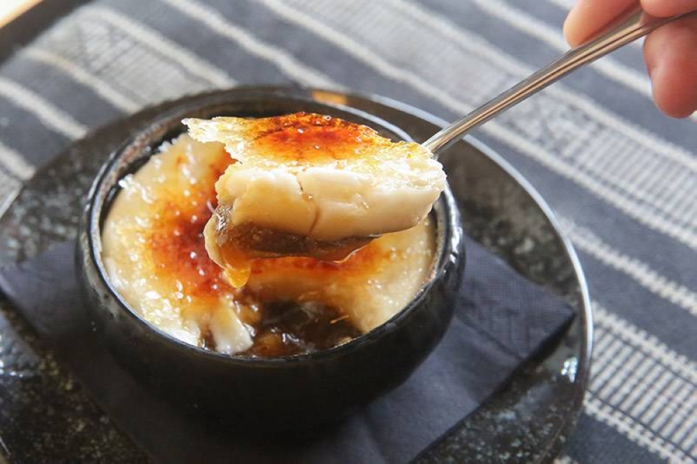 Relish the three layered dessert of Boko Ubi Kayu