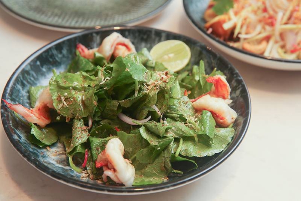 Get a healthy taste of the tangy 'pegaga' salad with sweet tasting grilled prawns