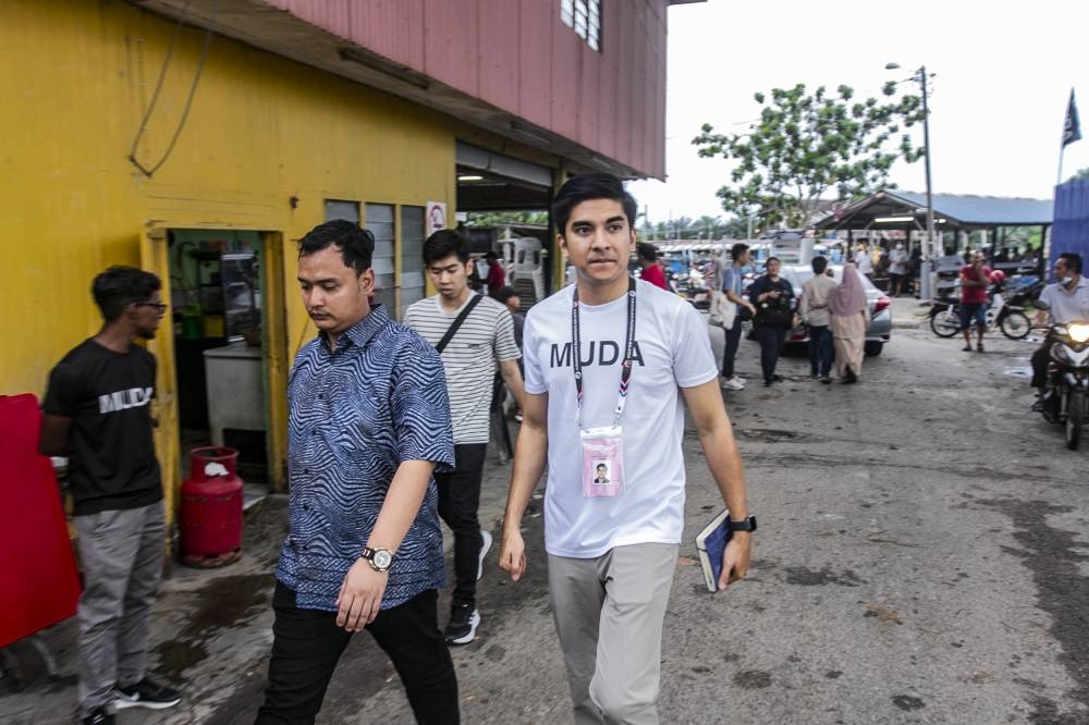 Syed Saddiq during a walkabout at Pantai Leka, Muar November 5, 2022. — Picture by Hari Anggara