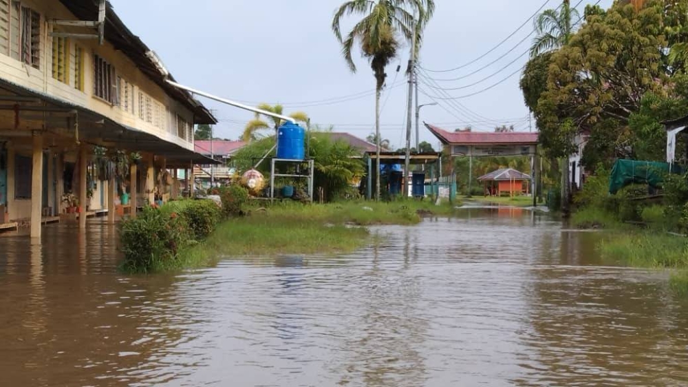 Photo shows the improved flood situation in Long Bemang this morning. — Borneo Post pic