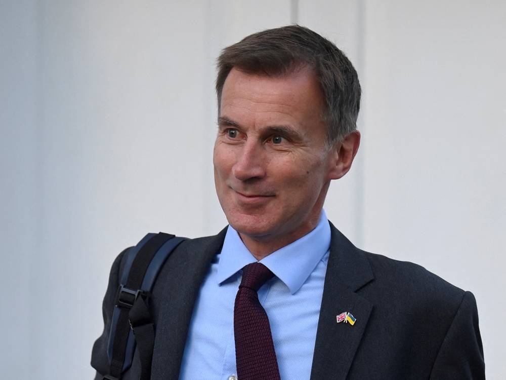 British finance minister Jeremy Hunt said he is under no illusion that there is a tough road ahead. — Reuters pic