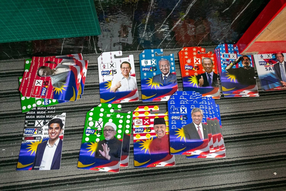 Few local political party design wrappers prepared by Mohd Ariffin Sokher at his house in Alor Gajah, Melaka on November 6, 2022 --- Photo by Raymond Manuel