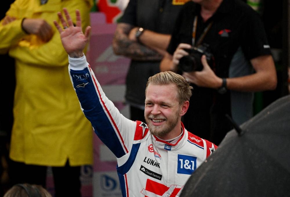 Haas' Kevin Magnussen celebrates after qualifying in pole position in Sao Paulo, Brazil November 11, 2022. ― Pool via Reuters/Nelson Almeida