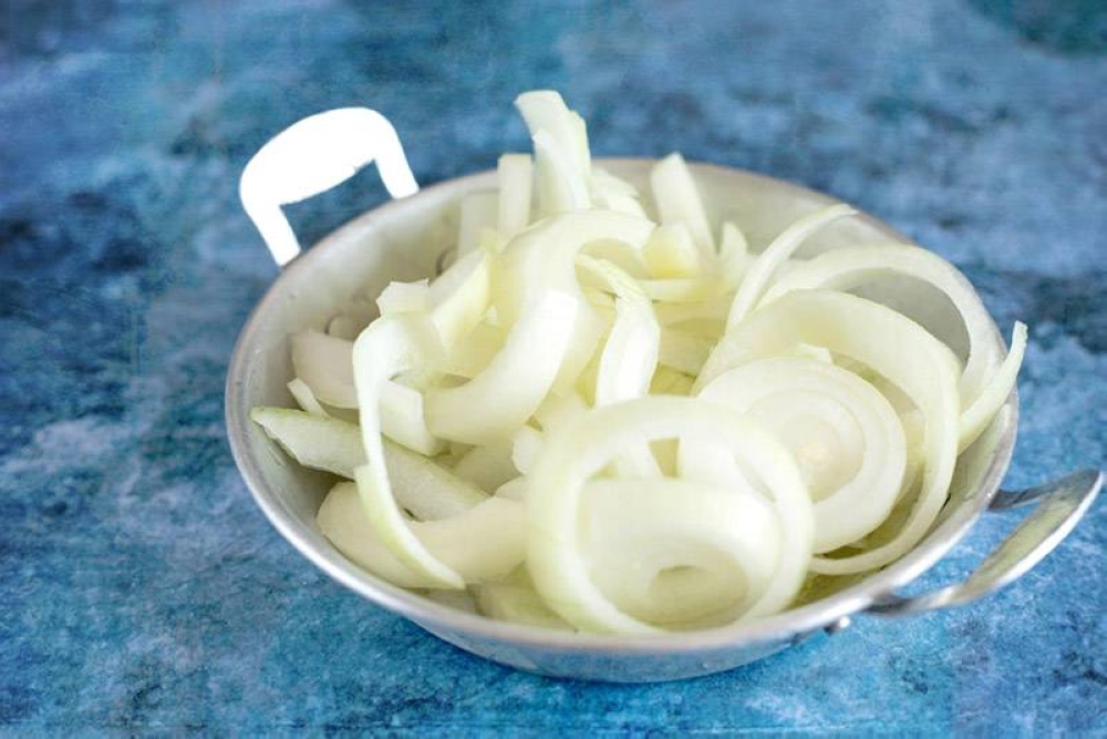 White onions sliced into rings.