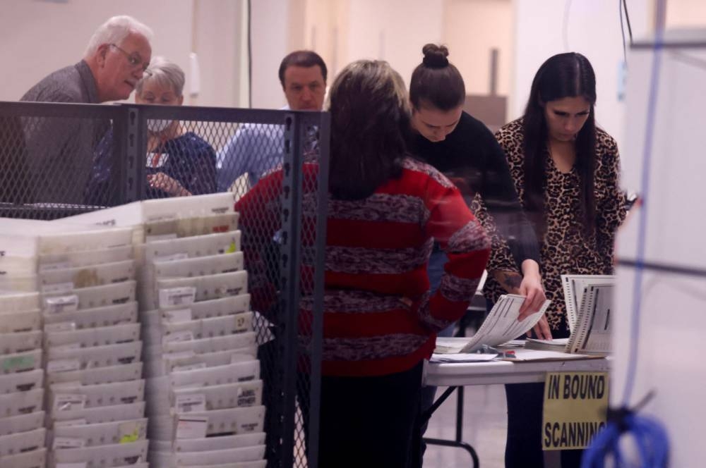 Staff work as they scan ballots for the US midterm elections at the Maricopa County Tabulation and Election Center in Phoenix, Arizona November 11, 2022. ― Reuters pic 