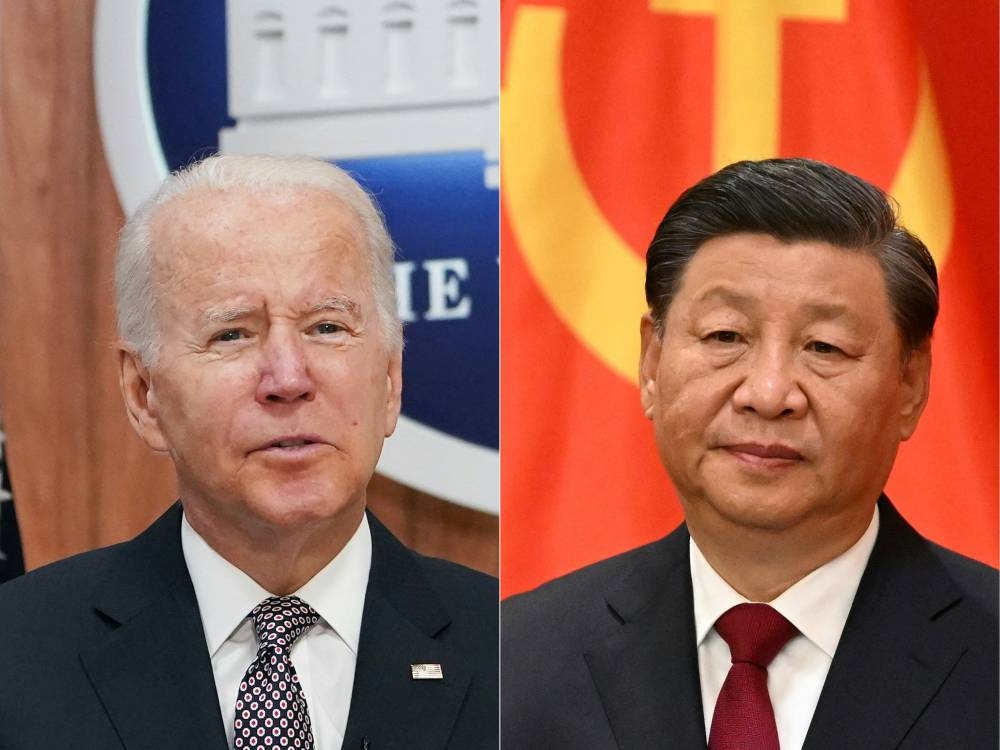 This combination of pictures created on November 11, 2022 shows US President Joe Biden (left) addressing the Major Economies Forum on Energy and Climate from the South Court Auditorium of the Eisenhower Executive Office Building, next to the White House, in Washington, DC on June 17, 2022 and China’s President Xi Jinping (right) speaking after walking with members of the Chinese Communist Party's new Politburo Standing Committee, the nation's top decision-making body, to meet the media in the Great Hall of the People in Beijing on October 23, 2022. ― AFP pic