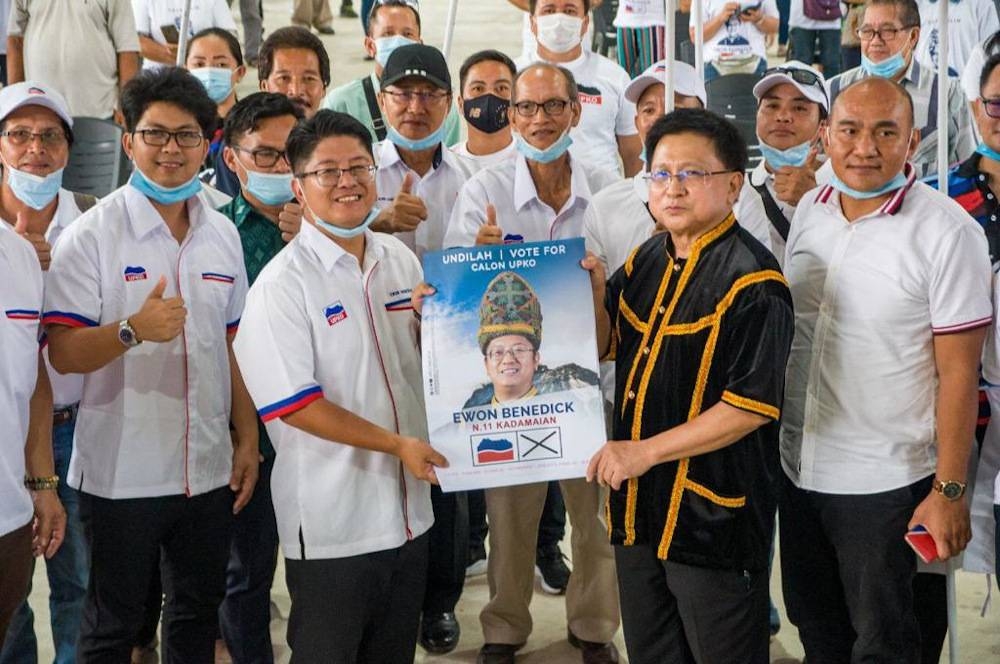 File picture shows Datuk Ewon Benedick and Tan Sri Richard Malanjum posing for pictures at the launch of the Upko election machinery at Kadamaian Square in Kota Belud September 12, 2020.