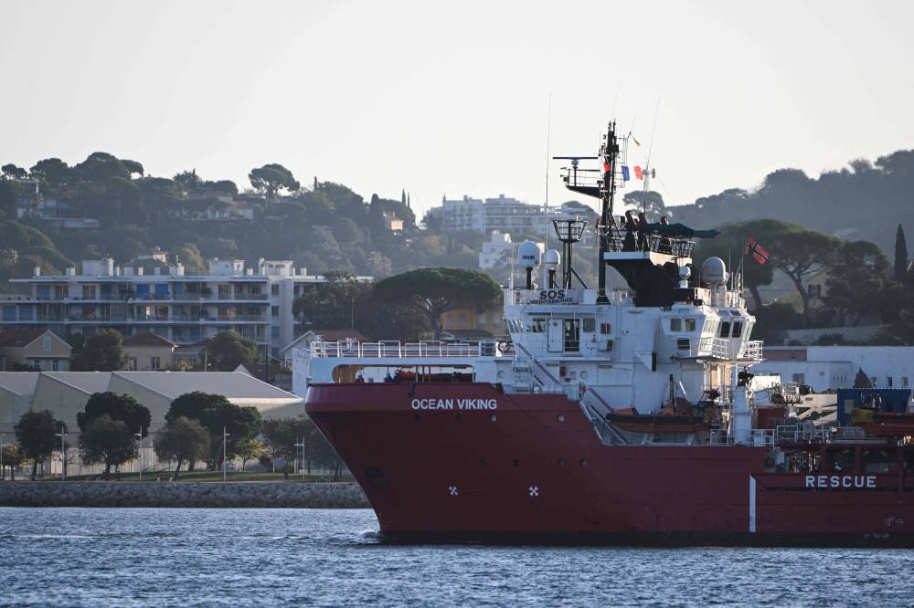 The Ocean viking ‘rescue ship of European maritime-humanitarian organisation ‘SOS Mediterranee’ escorted by a military boat arrives at Toulon, southern France, with migrants on board, on November 11, 2022. ― AFP pic