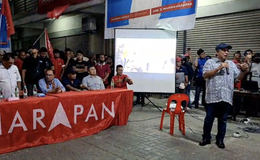 Anifah (right) speaks at a campaign rally at Sulaman Sentral in Kota Kinabalu on Nov 12, 2022. — Picture by Julia Chan