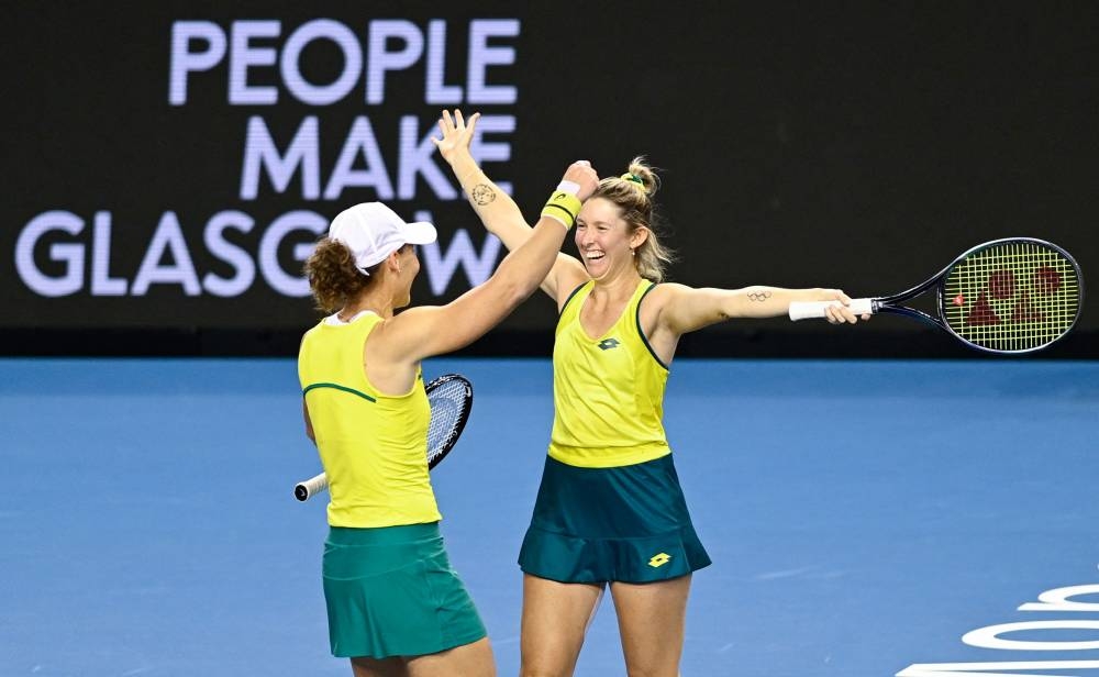 Australia's Samantha Stosur (L) celebrates with Australia's Storm Sanders (R) after their win in their doubles rubber against Britain's Alicia Barnett and Britain's Olivia Nicholls in the semi-final tennis match between Britain and Australia during The Billie Jean King Cup at The Emirates Arena in Glasgow on November 12, 2022. — AFP pic