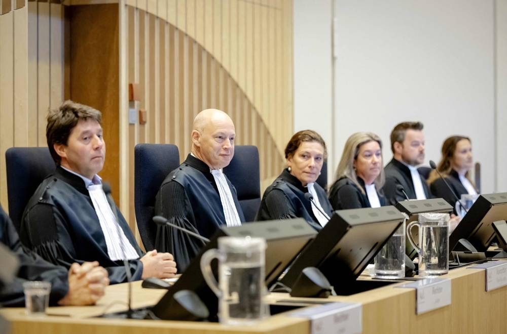 Judges and chairman Hendrik Steenhuis (centre) attend criminal proceedings regarding the crash of flight MH17 at the Judicial Complex Schiphol in Badhoevedorp, Netherlands June 9, 2022. — Photo by Robin van Lonkhuijsen / ANP / AFP
