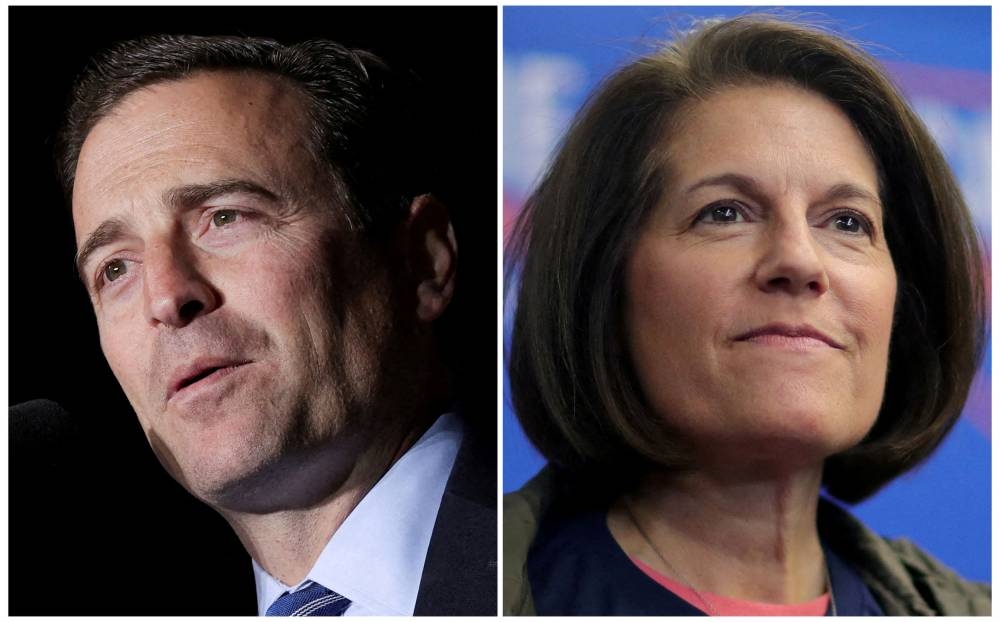 Republican US Senate candidate Adam Laxalt and Senator Catherine Cortez Masto, a Democrat, attend rallies ahead of the midterm elections in Minden, Nevada October 8, 2022 and Henderson, Nevada November 7, 2022 in a combination of file photographs. — Reuters pic