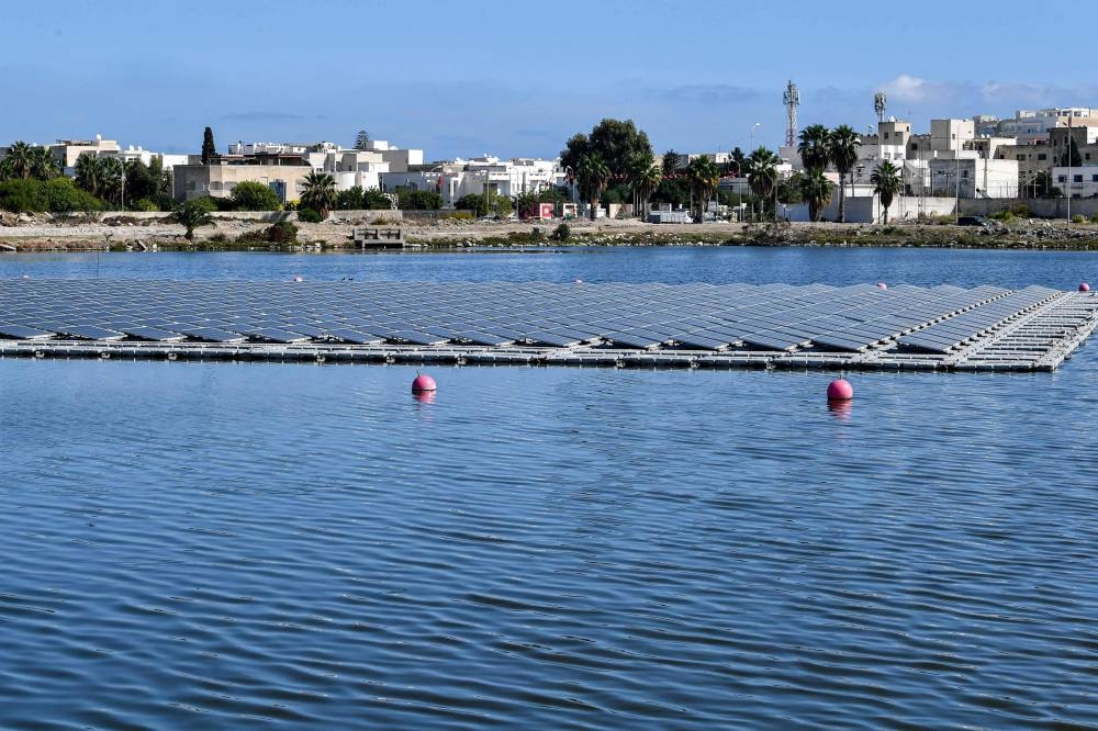 This picture taken on October 19, 2022 shows a view of floating solar panels in a water reservoir in Le Kram, on the eastern edge of Tunisia's capital Tunis. — AFP pic