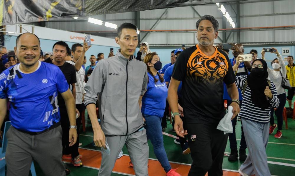 Barisan Nasional’s Sungai Buloh candidate Khairy Jamaluddin teamed up with former world number one shuttler Datuk Lee Chong Wei for a friendly badminton match. — Picture by Miera Zulyana