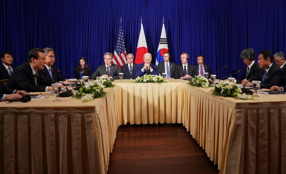 US President Joe Biden attends a trilateral meeting with South Korean President Yoon Suk-yeol and Japanese Prime Minister Fumio Kishida (not seen), in Phnom Penh, Cambodia, November 13, 2022. — Reuters pic