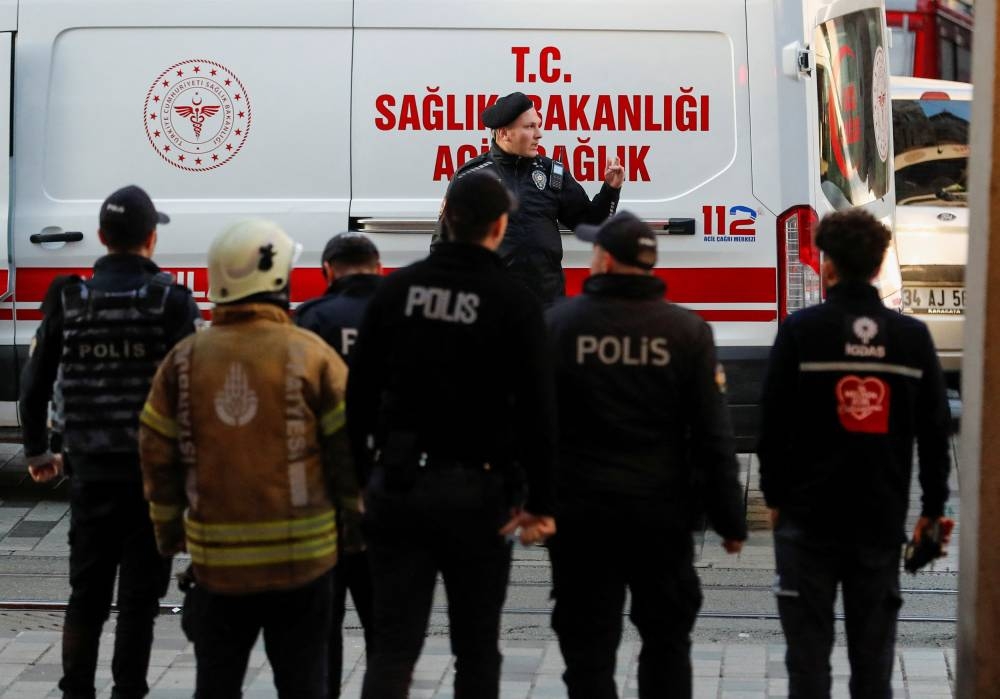 Police officers and rescue members work after an explosion on busy pedestrian Istiklal street in Istanbul, Turkey, November 13, 2022. — Reuters pic