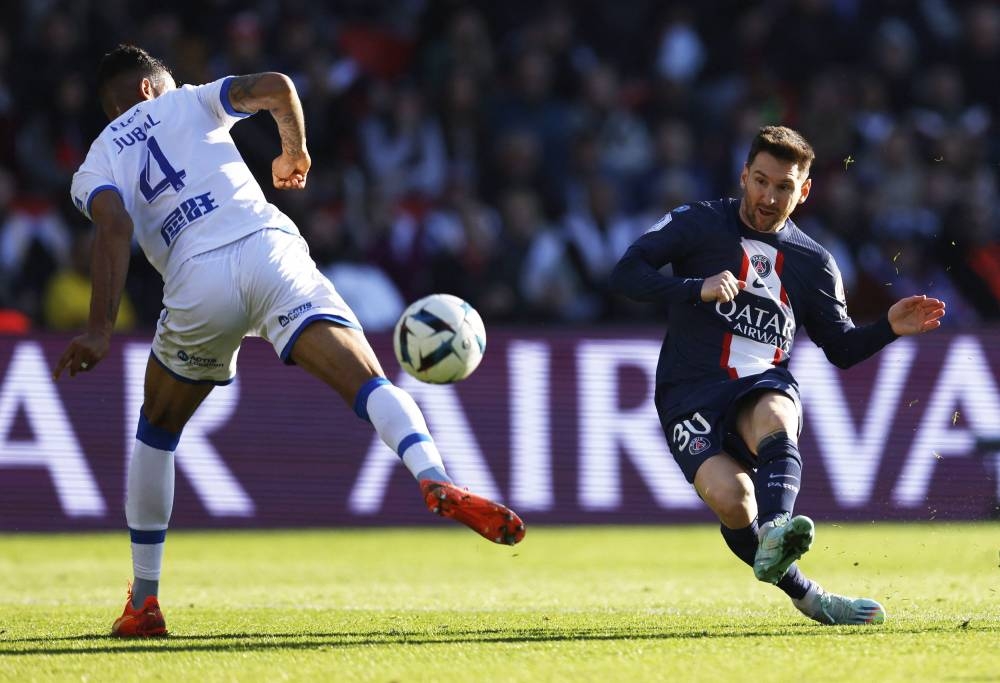 Paris St Germain’s Lionel Messi in action with Auxerre’s Jubal at the Paris St Germain v Auxerre at Parc des Princes, Paris, France November 13, 2022. — Reuters pic