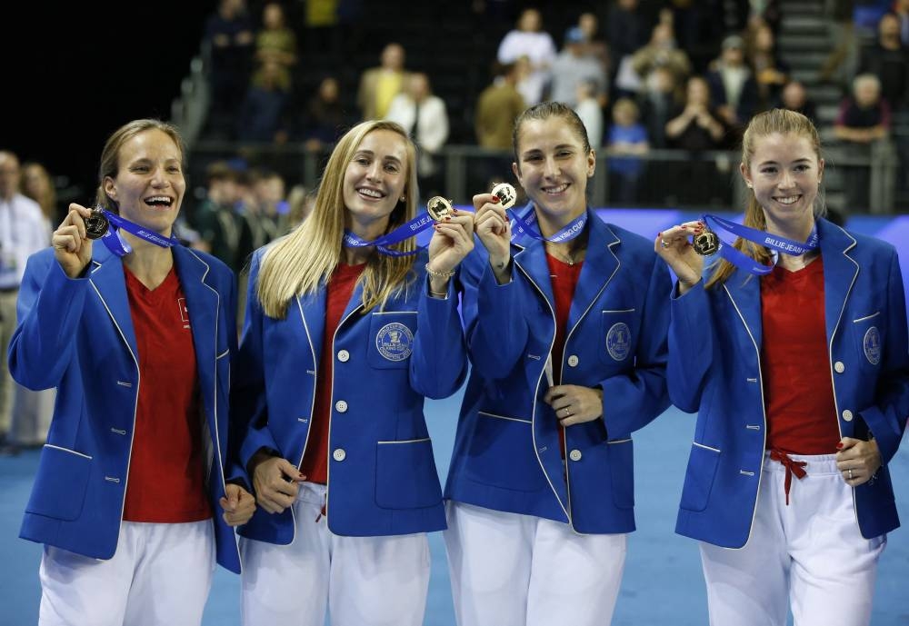 Switzerland's Belinda Bencic, Jil Teichmann, Viktorija Golubic and Simona Waltert celebrate winning the Billie Jean King Cup Finals at the Emirates Arena, Glasgow November 13, 2022. — Reuters pic